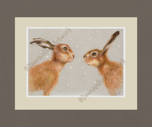 Two hares facing each other in the snow - example of artwork on a wall